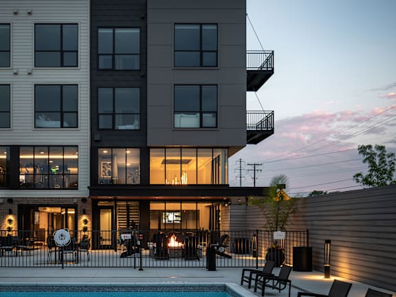 a rendering of a building with a street in front of it at Flats at Iron Ridge, Ferndale, MI