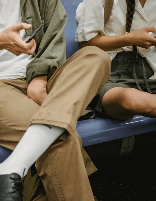 People using phone on subway at Lynk De la Savane Apartments, Montreal, QC