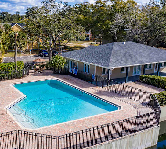 A house with a pool in the backyard.