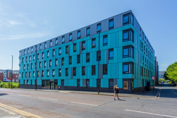 a blue building on the corner of a street