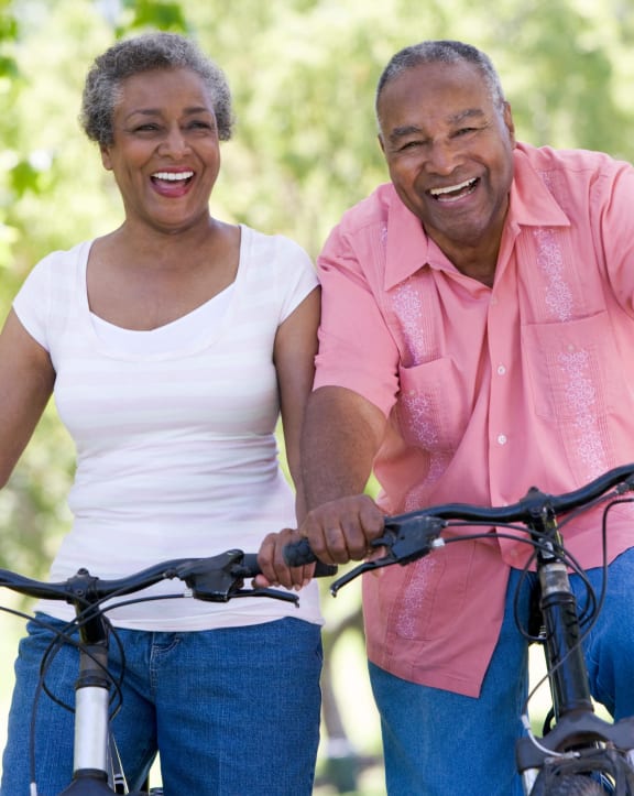 a man and a woman riding bikes together