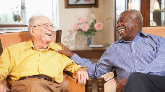 Elderly men sitting on chairs