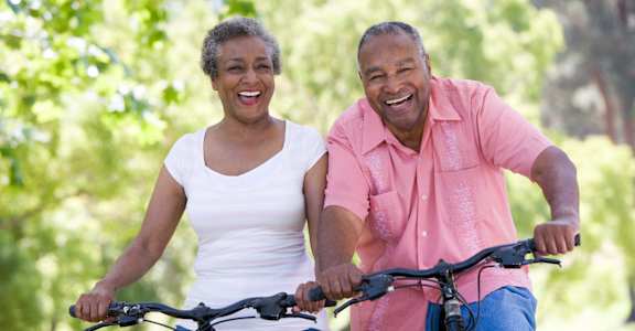 An older couple is riding bikes together in a park.at Union at Crescent, Indiana, 47404