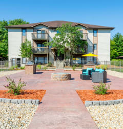 an outdoor courtyard with a building in the background