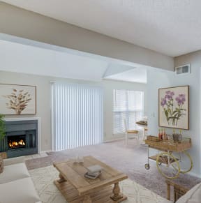 a living room filled with furniture and a large window