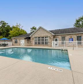 A pool with a 3 feet no diving sign.