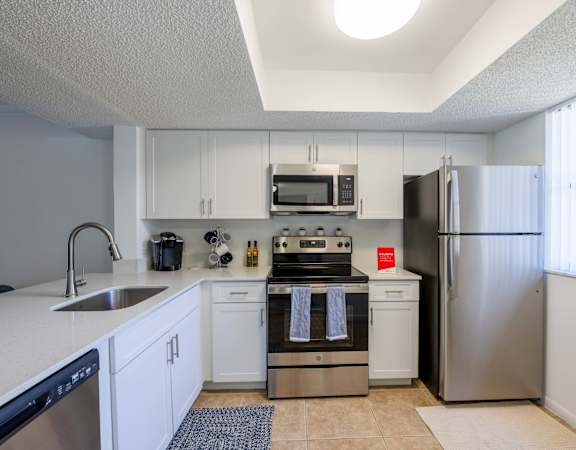 the preserve at ballantyne commons apartment kitchen with stainless steel appliances
