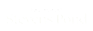 A green sign that says Residences at Stevens Pond.