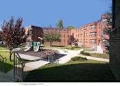 Thumbnail 1 of 4 - a view of a playground in front of a brick building