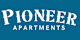 A blue sign with the words "Pioneer Apartments" in white.
