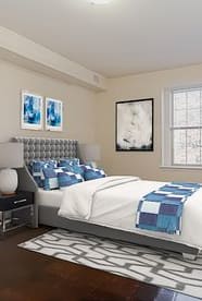 a bedroom with a large bed and a ceiling fan