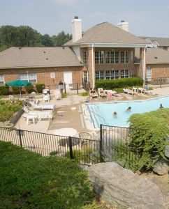A large house with a pool in the backyard.