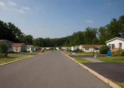 A residential street with houses on both sides.