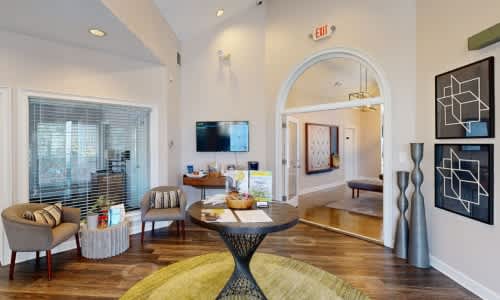 A living room with a TV, couches, and a coffee table.