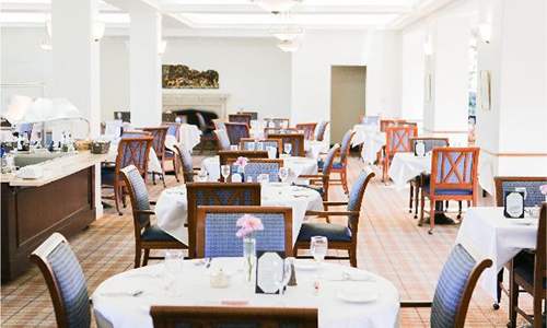 A restaurant with tables set for dining.
