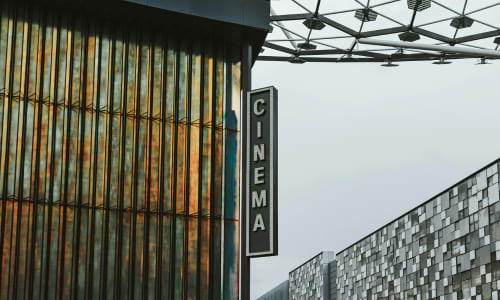 A neon sign that says Central Cinema.