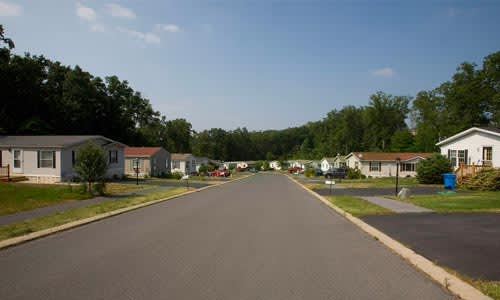 A residential street with houses on both sides.