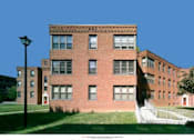 Thumbnail 3 of 4 - a large brick building with a staircase in front of it