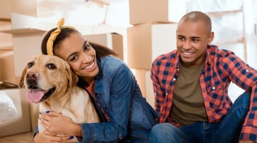 a couple sitting on the floor with a dog at Parkland Village, Forestville, MD 20747