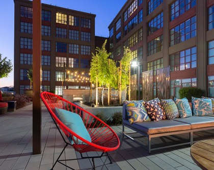 Outdoor couch at Aqua Via Apartments, Oakland, CA