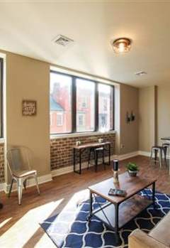 a living room with a couch and a table