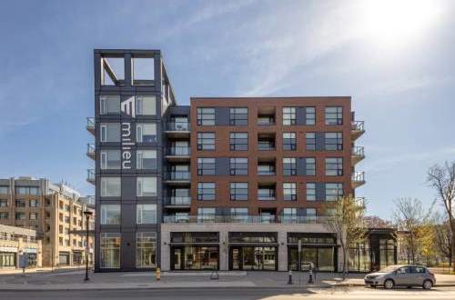 A modern multi-story building with the word "multi" on the side.
