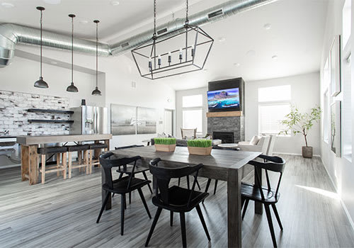 a large dining room with a table and chairs