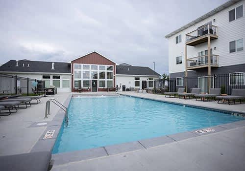a large swimming pool in the middle of two buildings