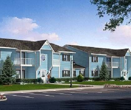a row of blue houses on the side of a street