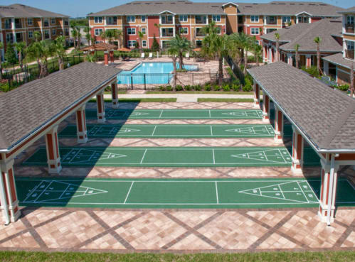 Shuffleboard Court and Pool at Grand Reserve Apartments in Zephyrhills, FL