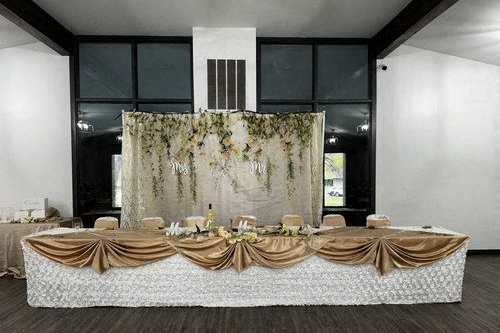 a long table with a table cloth and a centerpiece