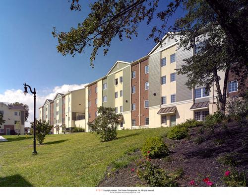 an image of an apartment building on a hill