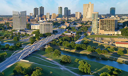 A cityscape with a river running through it.