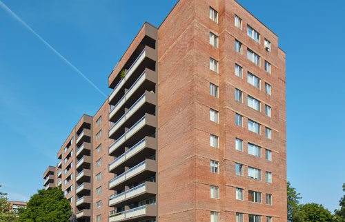 Exterior view of the complex on a blue sky day.