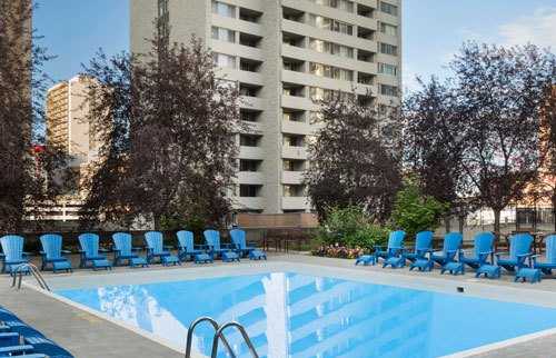 Outdoor pool with lounge chairs