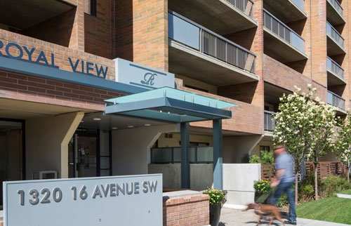 exterior of the front entrance and a person walking