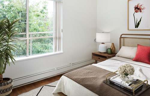 Image of a staged suite, this image is of a bedroom.