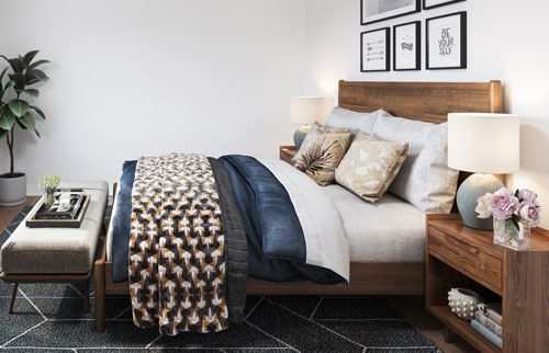 Staged bedroom with queen-sized bed