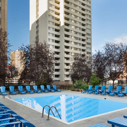Outdoor pool with lounge chairs
