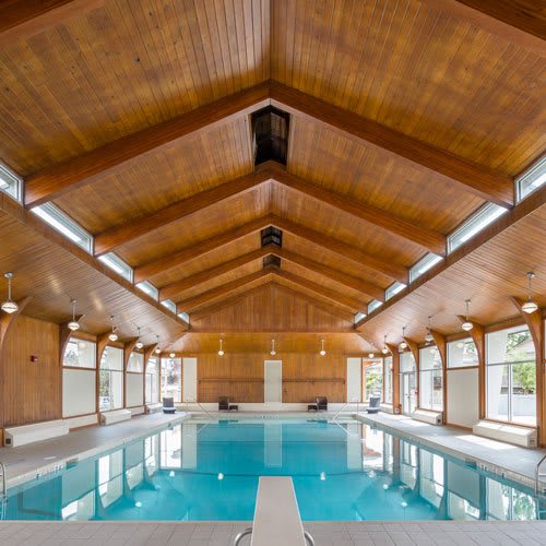 indoor pool with a diving board