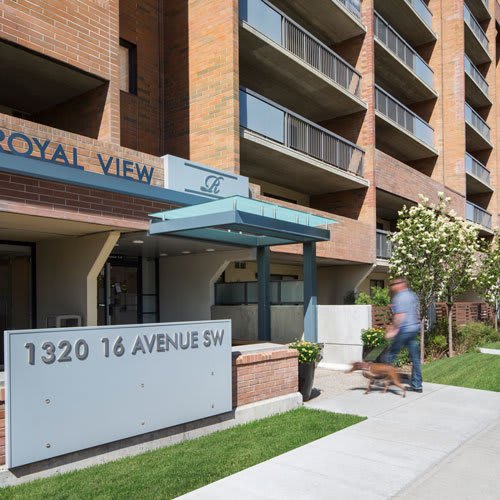 exterior of the front entrance and a person walking