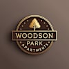 The image is a logo for Woodson Park Apartments.