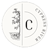 A black and white image of a tree and people in the water with the letter C in the middle.