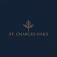 A logo with the text "St. Charles Oaks" and a stylized tree branch.