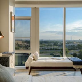 a bedroom with a bed and a large window at Altaire, Arlington, Virginia