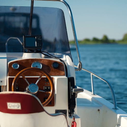 a boat with a steering wheel on a body of water at Harbor Heights 55+ Community, Olympia, 98501