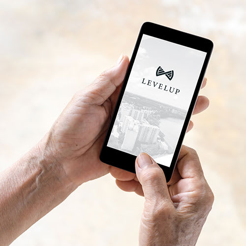 a person holding a smartphone with a screen showing a bow tie