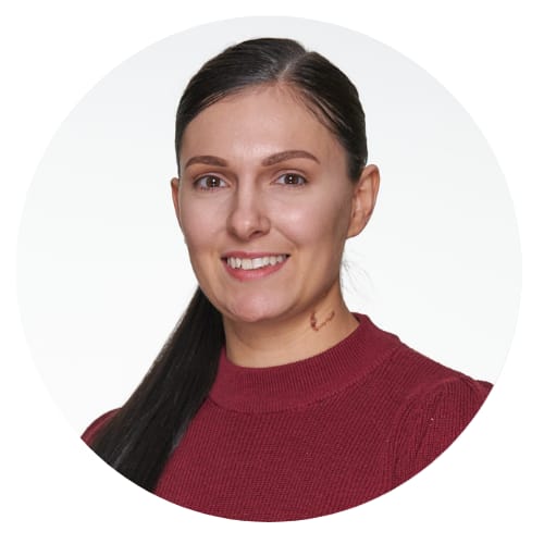 a woman with long hair and a red sweater