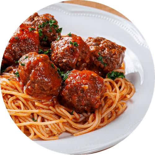 A plate of spaghetti with meatballs and sauce.