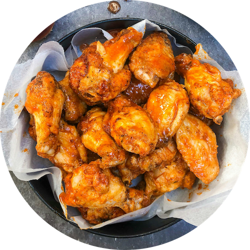 a plate of chicken wings in a pan